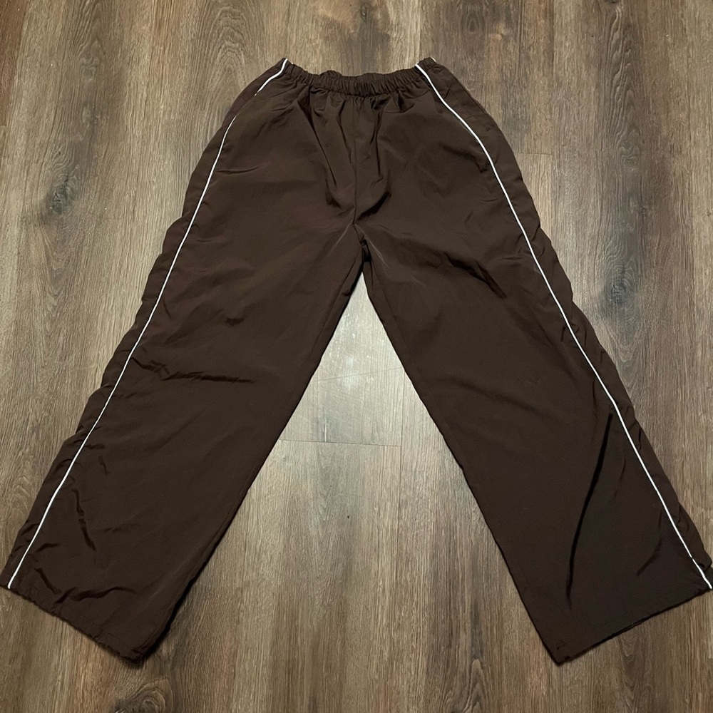 brown parachute like pants